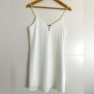 This loose fitted summer dress has adjustable spaghetti straps